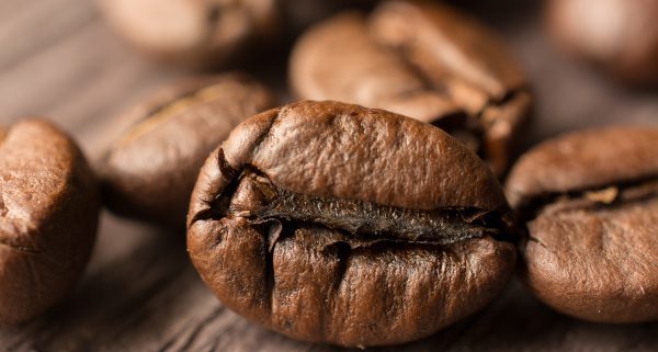 coffee beans on wooden board, closeup